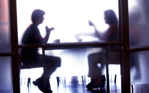 People Sitting Behind Glass